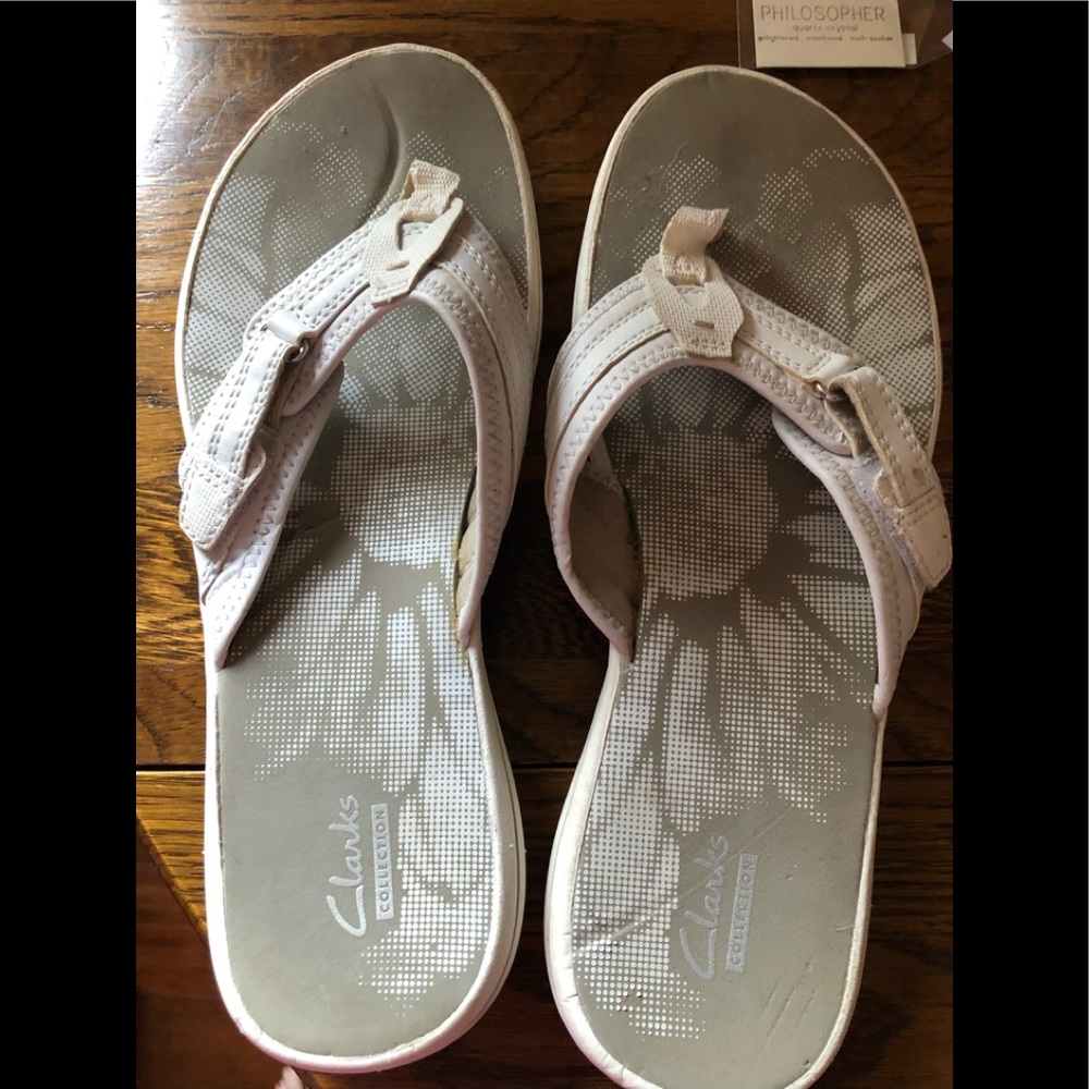 Clark’s white thong flip flops